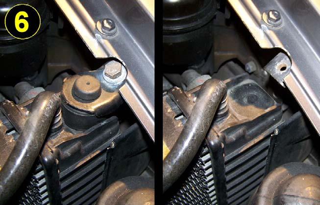 Using two wrenches in opposition, disconnect the oil lines where they attach to the radiator on the inside left end tank, and, if the 928 is an automatic, disconnect the transmission
