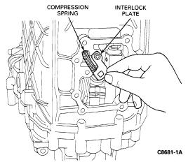 Page 3 of 15 CAUTION: Make sure that parts do not inadvertently fall into transmission. 9. Place a drift punch against the detent bolt sealing cap. Hold the drift at an angle.