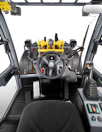 Driver's cabin Ergonomic workplace: plenty of legroom, clearly arranged combi-instruments, comfortable air suspension seat and an adjustable joystick console.