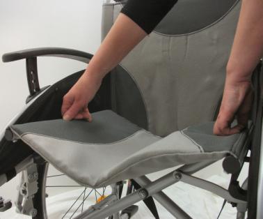 5.2 Unfolding and folding the wheelchair Unfolding the wheelchair Make sure you stand next to the wheelchair; Grab both seat tubes and move them apart; Push both seat tubes downwards so that the