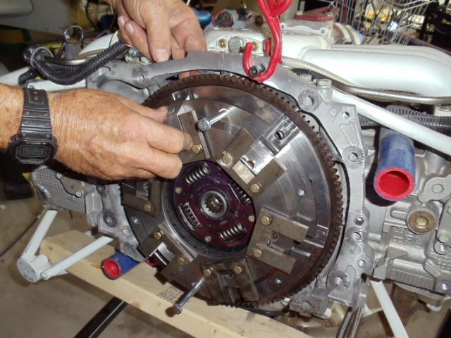 just to hand tight. Alternately tighten them down with a socket wrench until all are snug, then torque to 30 ft lbs using the alternating method.