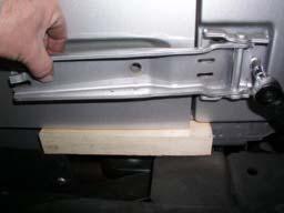 Mark and grind out area shown on factory tailgate hinges to allow