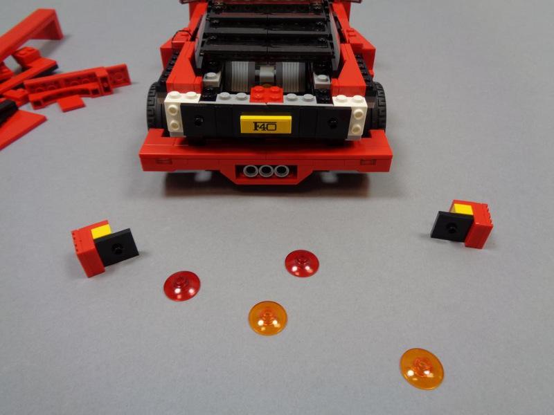 Step 18 Mount the Tail Lights As shown in the first photo, remove the large orange and red transparent LEGO dishes from the rear of the car.