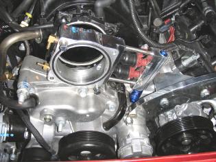 5.8 Throttle Body Spacer Installation 5.8.1 Remove the 4 throttle body bolts and remove the throttle body. 5.8.2 Position the Throttle Body Spacer against the intake manifold with the O-Ring groove facing away from the manifold.