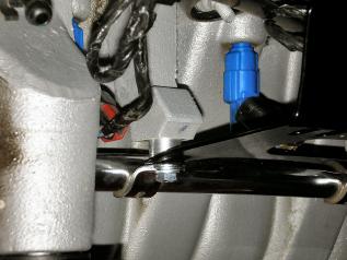 2 Install the intercooler bracket, fuel rail and spacers with two bolts as shown.