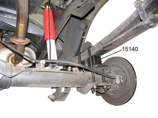 RISER BLOCK INSTALLATION FINAL CHECKS & ADJUSTMENTS 1. 2. Support the rear axle with a floor jack. Remove the rear shock absorbers. 1. Turn the front wheels completely left then right.