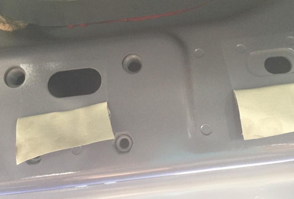 2. Check either side of the vehicles rocker panel, locate the factory holes in the rocker panel by removing the tape.