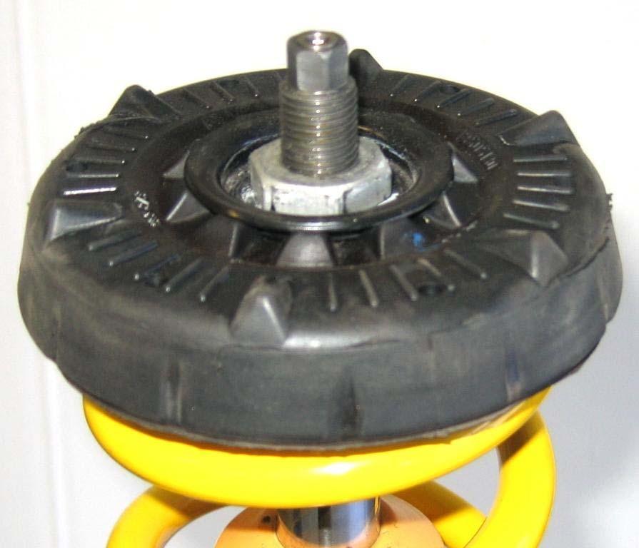 Front axle: Supplied coilover strut. Install the factory top mount and secure it with the standard nut.