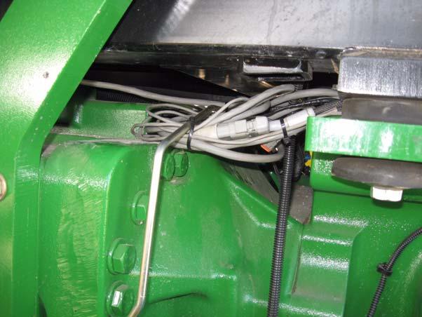 Connections Inside the Cab 4. Neatly coil and secure any excess cable from being damaged by moving parts beneath the cab as shown in Figure 5-28.