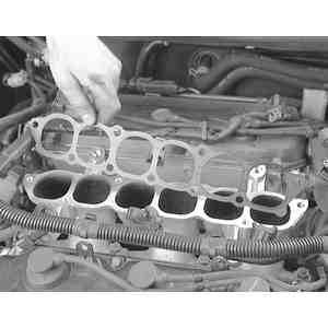 Remove the 7 bolts attaching the upper intake plenum to the lower manifold, and
