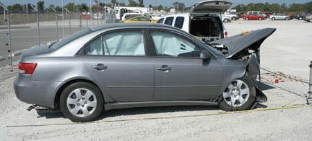 side damage showing deployed right side curtain air bag Post-Crash: The driver of the Hyundai remained inside the vehicle at final rest.