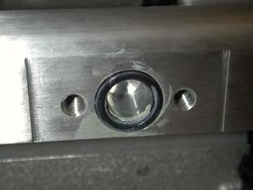 Apply a small amount of grease to the new supplied fuel manifold O-ring and set in the machined recessed