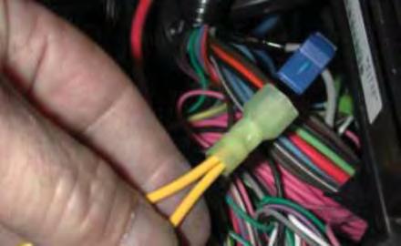 In the wiring below the fuse/relay center, locate the gray fuel pump wire that goes from the relay center down the frame towards the rear of  