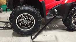 ATV Manual Plow Lift Adjustment and Mounting Guide Mounting the manual lift. 1. Position the tube frame under the ATV. You can simply drive the ATV over the lift handle.