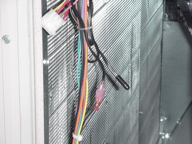 The cable has two wires with insulated connectors that the Discharge Air Sensor plugs into.