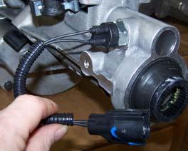 Install cable retainer bolt and tighten bolt to 4 lb.-ft. Connect cable to speedometer.