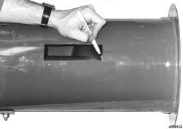 Figure 22. Marking auger inside tube 9. Remove auger from tube and mark auger flighting 3/8 in. outside each of the original marks (3/8 in. lengthwise on the auger, not 3/8- in.
