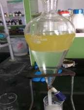 By treating with hot water the heavy glycerol content in the form of soap will settle at bottom of the flask due to its weight and the biofuel being less in weight will float at top.