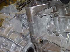 The bracket will use two holes on the transmission and two on the engine.