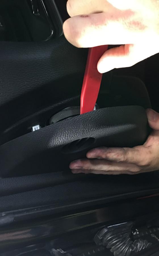 Step 39: Remove the end cap on the drivers side of the dash using a trim tool.