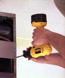 Use a screwdriver or similar tool to free flue cap from frypots. Remove flue cap by lifting up and off of fryer.