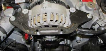 32. Use a 10mm socket to remove the two outer alternator bracket bolts, and an 8mm socket to remove the two inner