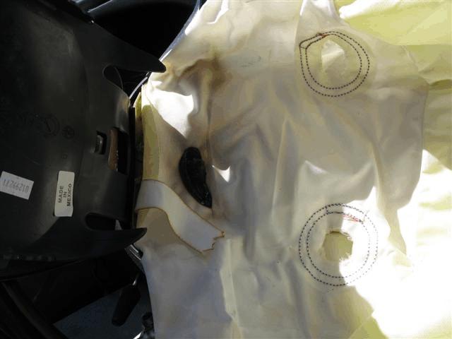 Figure 13. Melted plastic on air bag (subject vehicle) Figure 14.