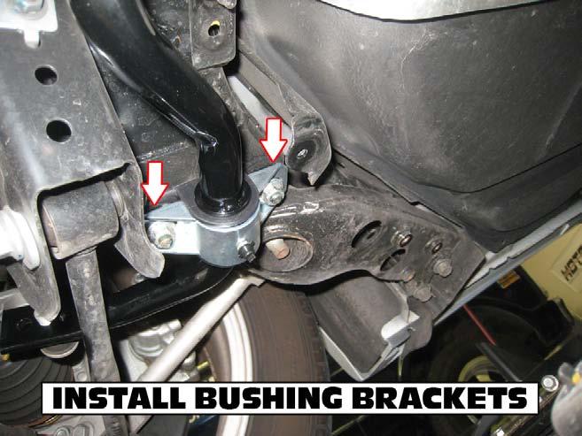 10) Install the Hotchkis brackets over the bushings and using the factory bolts, tighten the bar to