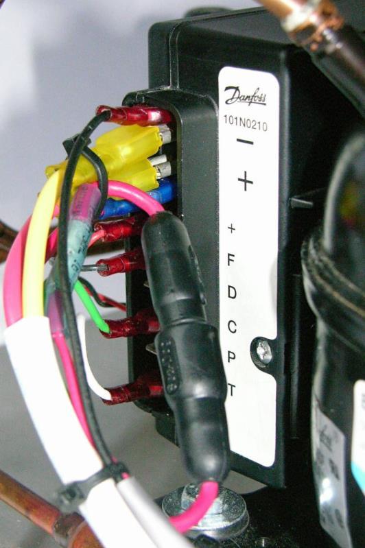 2. The Full Gauge positive (+) 12 volt DC supply wire (241-0001, red) connects to a waterproof AGC inline fuse holder (017-2011) with an adhesive lined heat shrink butt connector (290-0212) before