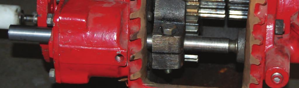 A fork shifts the collar either to engage it with teeth on the drive sprocket hub (PUMP) or to engage it with the teeth on the coupling shaft (ROAD).