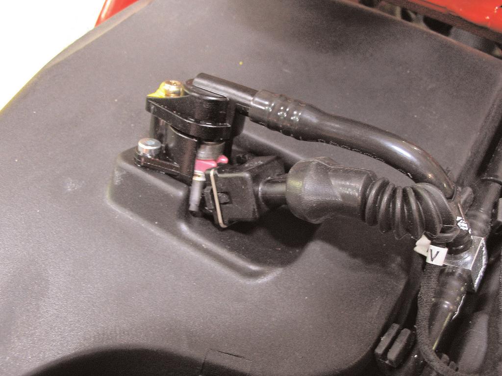 8 Unplug the stock wiring harness from the rear injector (Fig. E) This injector is located on top of the Fig. E air box.