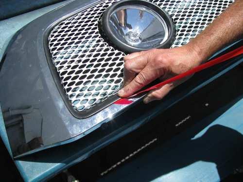 10. Apply the adhesion promoter to the area on the grille shell where the grille surround will make