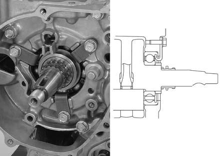 When installing the retainer plate, pull the crankshaft and hook the plate tab to the crankshaft bearing groove as shown.