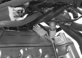 Connect the engine sub-harness 8P (Gray) connector. Route the wire band through the hole on the gearshift linkage cover.
