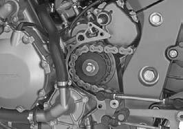Install the washer and drive sprocket bolt, and tighten the drive sprocket bolt to the specified torque. TORQUE: 54 N m (5.