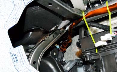 Side Cutter (k) Route the V4 Harness behind the Center Brace towards the Driver s Side Area. (Fig. 6-9) (l) Use 2 Wire Ties to secure the V4 Harness to the Reinforcement in the Glove Box Area. (Fig. 6-9) Fig.