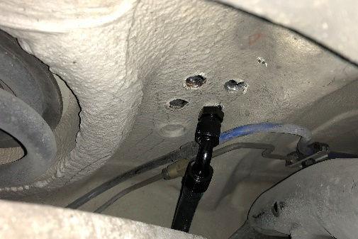 From the underside of the car, insert the bulkhead fittings for #1 and #3 hoses into the #1 and #3 holes in the floor.