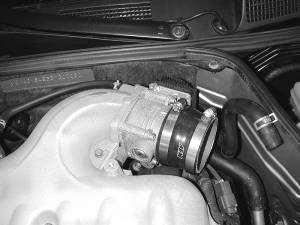 Place the 3.25-3.0 reducing silicone coupler on the throttle body. Use a #52 hose clamp around the throttle body.