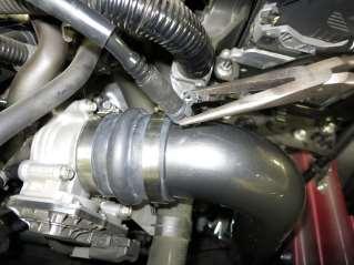 k. Trim 3/4 inch off the provided hose(aem-5-1002) and install it onto the intake tube along with the spring clamp