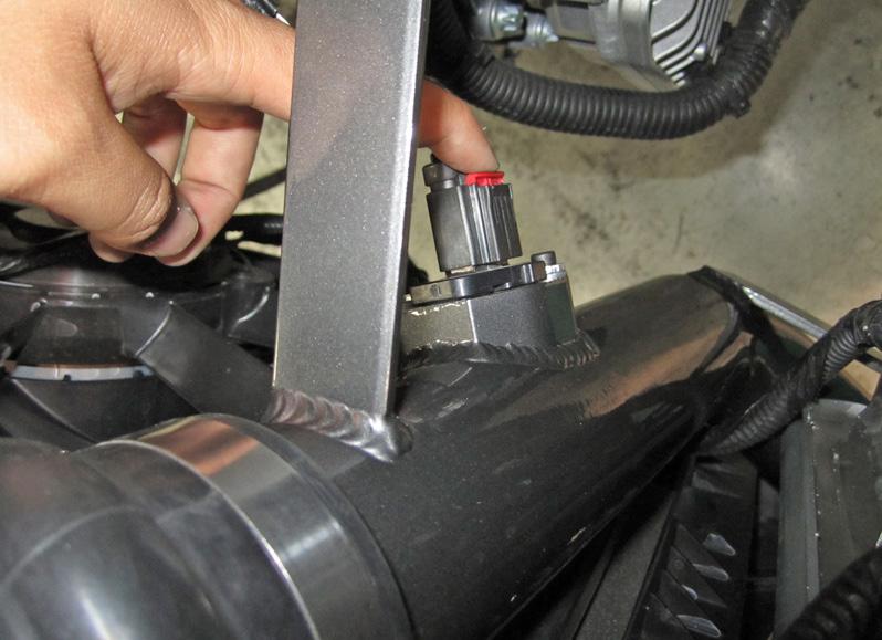 r. Check the upper intake pipe s position within the hump coupler by squeezing the edge