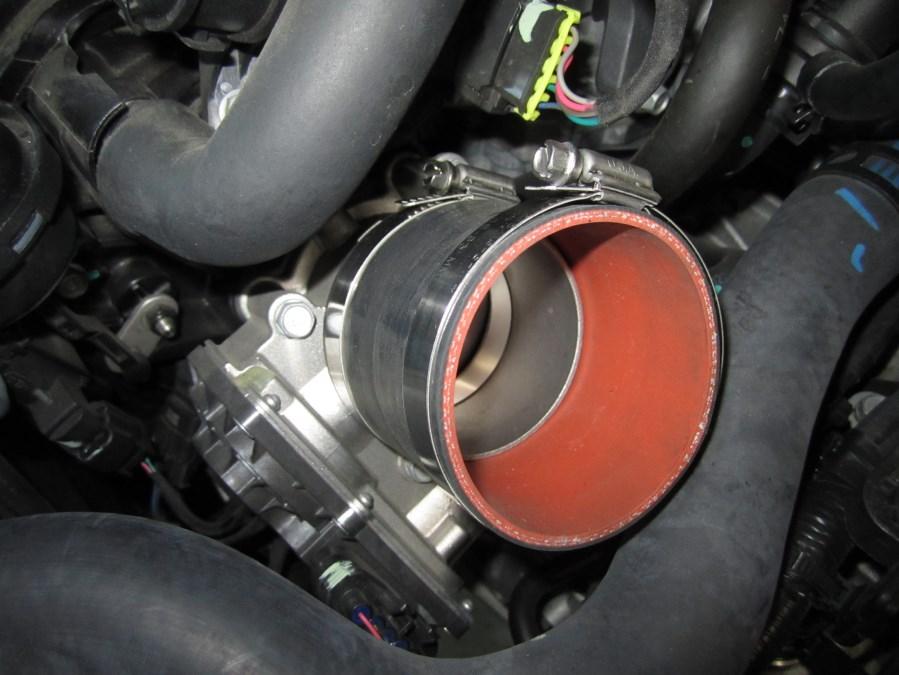 flange. Tighten the hose clamp over the throttle body flange and leave the other clamp loose. B.