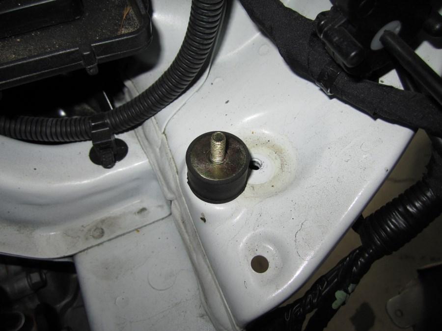 Use the M6 threaded hole to the left of the hole actually used to mount the stock air box. C.