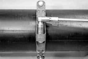 INSTALL REMAINING SEGMENT ASSEMBLY: Install the second assembly onto the pipe. Make sure the housings keys engage the grooves properly on both pipes.