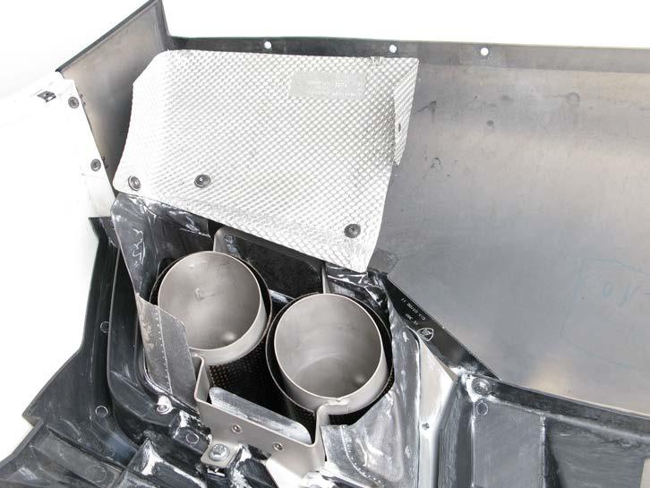 10. Install the stock tail pipe heat protection on both sides of the bumper trim panel, using stockbolts (Figure 47).