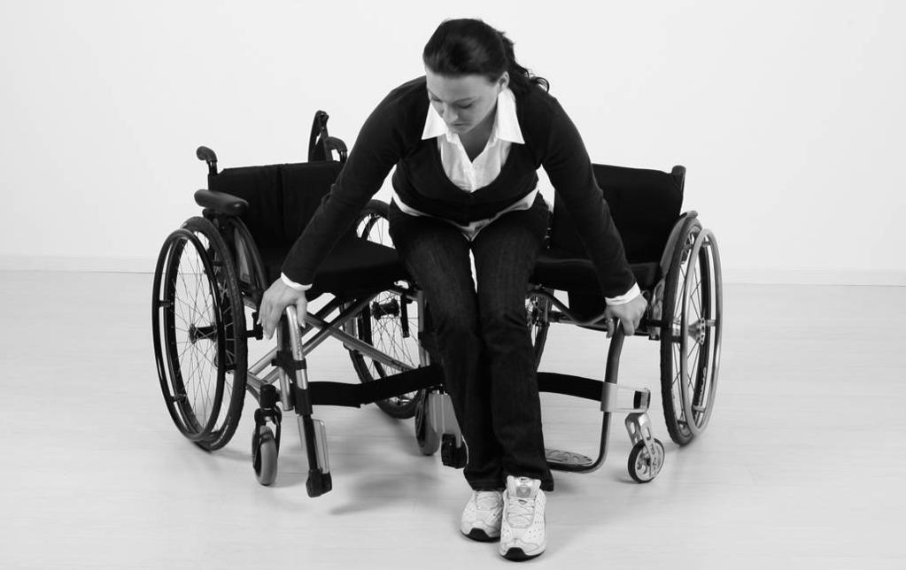 3) On the other wheelchair, engage the wheel locks and fold up the footrest (footplate) (see fig. 7). 4) Move your feet from the footplate onto the floor and move forward in the wheelchair (see fig.