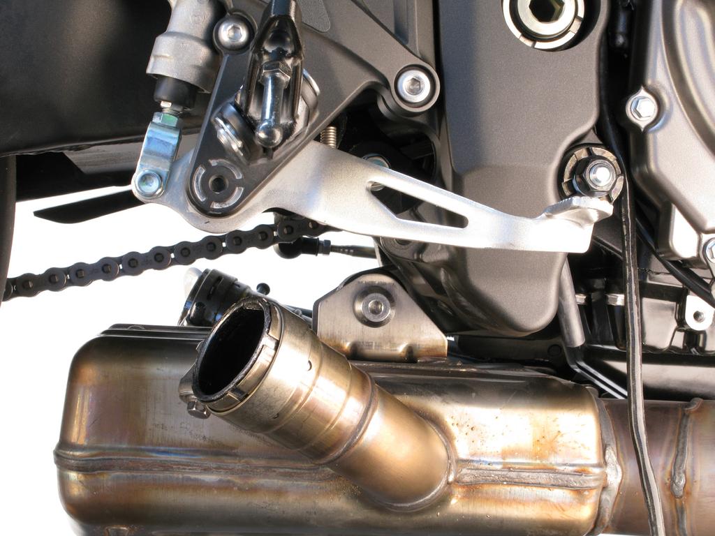 Unscrew the marked bolt and carefully remove the headers off the motorcycle (Figure 6).