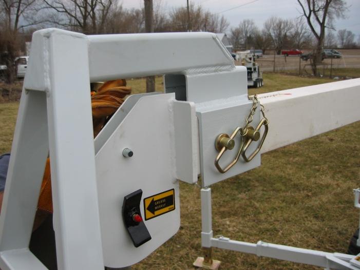 2. Unpin pole guide attachment from trailer and
