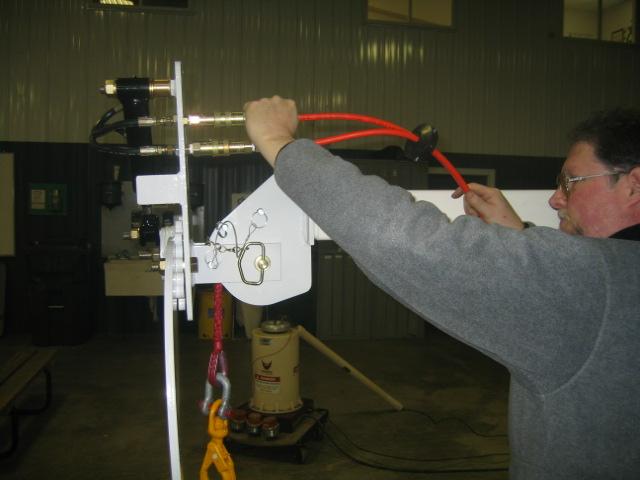 3. Connect hose reel lines to hydraulic claw