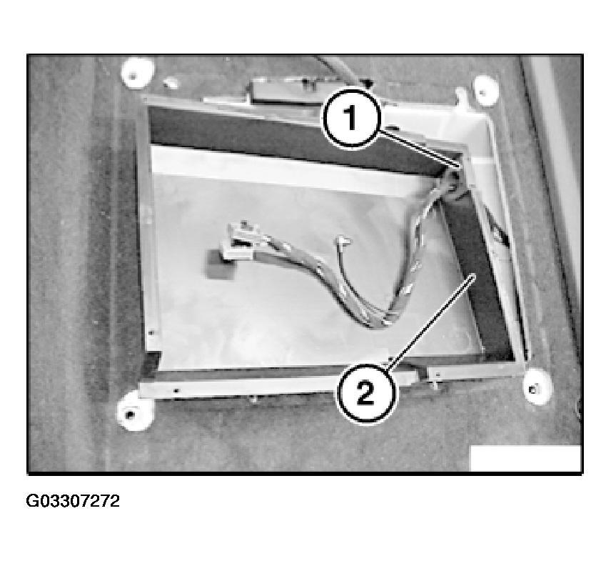 Fig. 34: View Of Cable Grommet In Housing Replacement only: Unlock