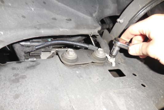 134. Connect the black ground wire from the intercooler pump harness to the bolt location shown with